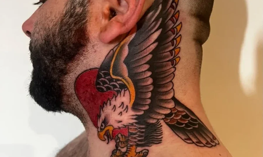 Bold head and neck tattoo by Danny