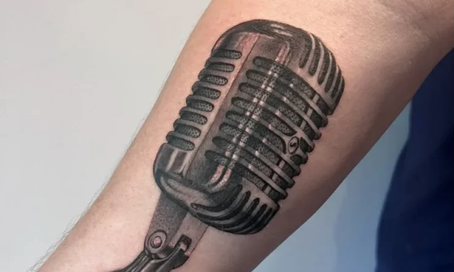 Black and grey forearm tattoo by Danny