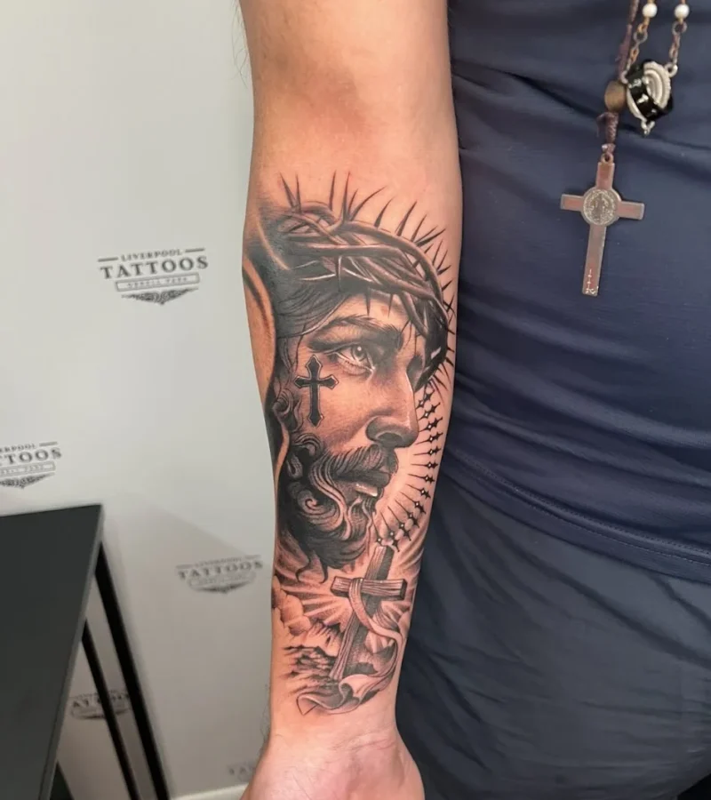 Black and grey arm tattoo by Danny