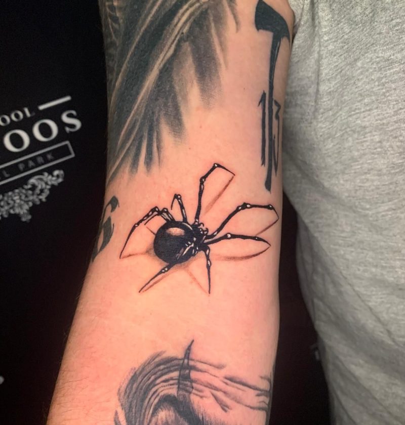 spider tattoo in hand